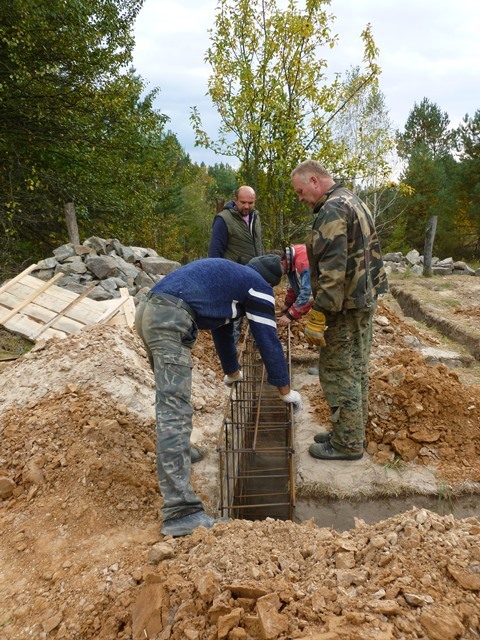 Workers set up the shelter's foundations